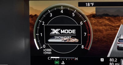 The X-MODE traction control settings in the digital dashboard display of a Subaru vehicle.