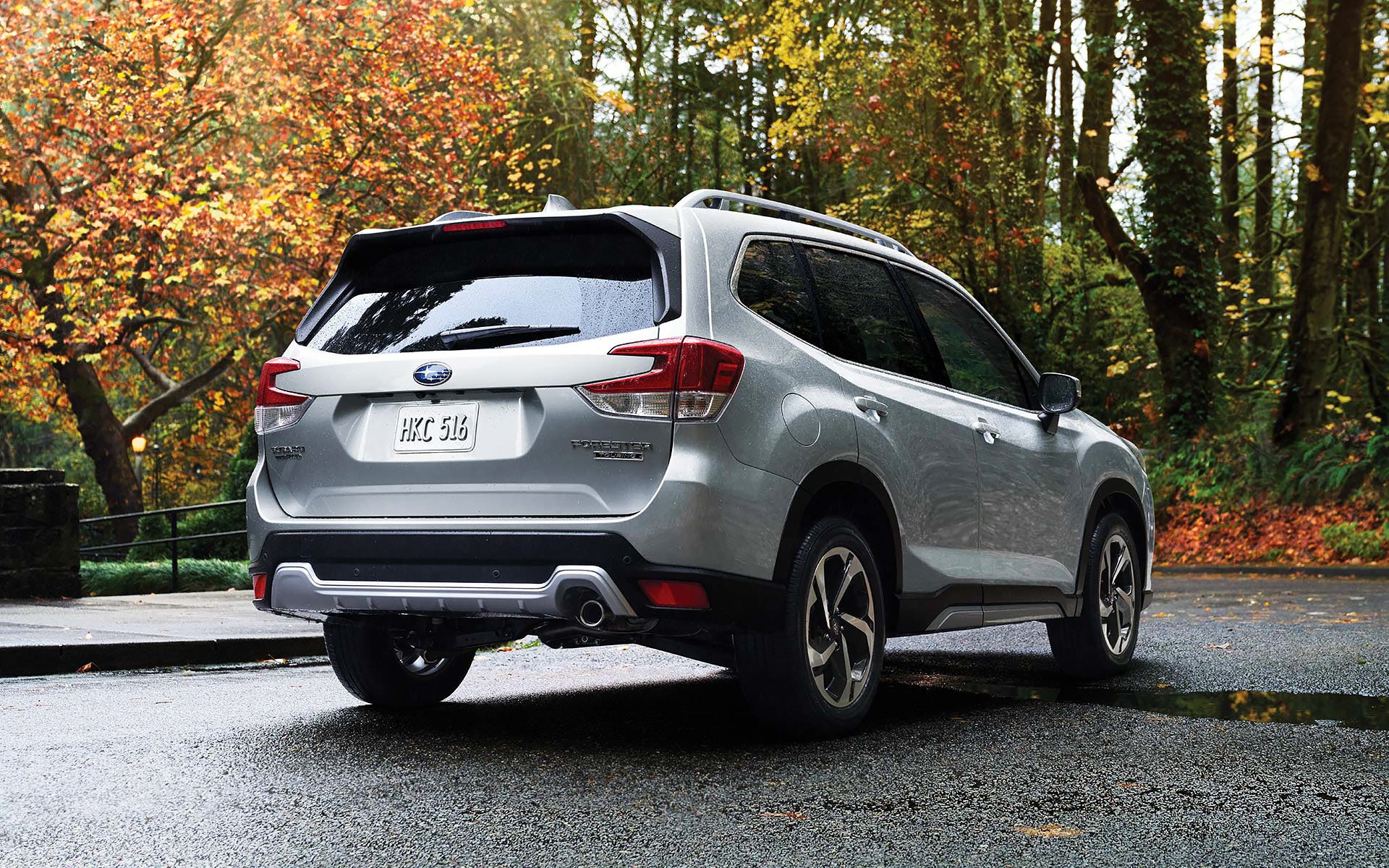 The rear of the 2022 Forester on a neighborhood street. | LaFontaine Subaru in Commerce Township MI