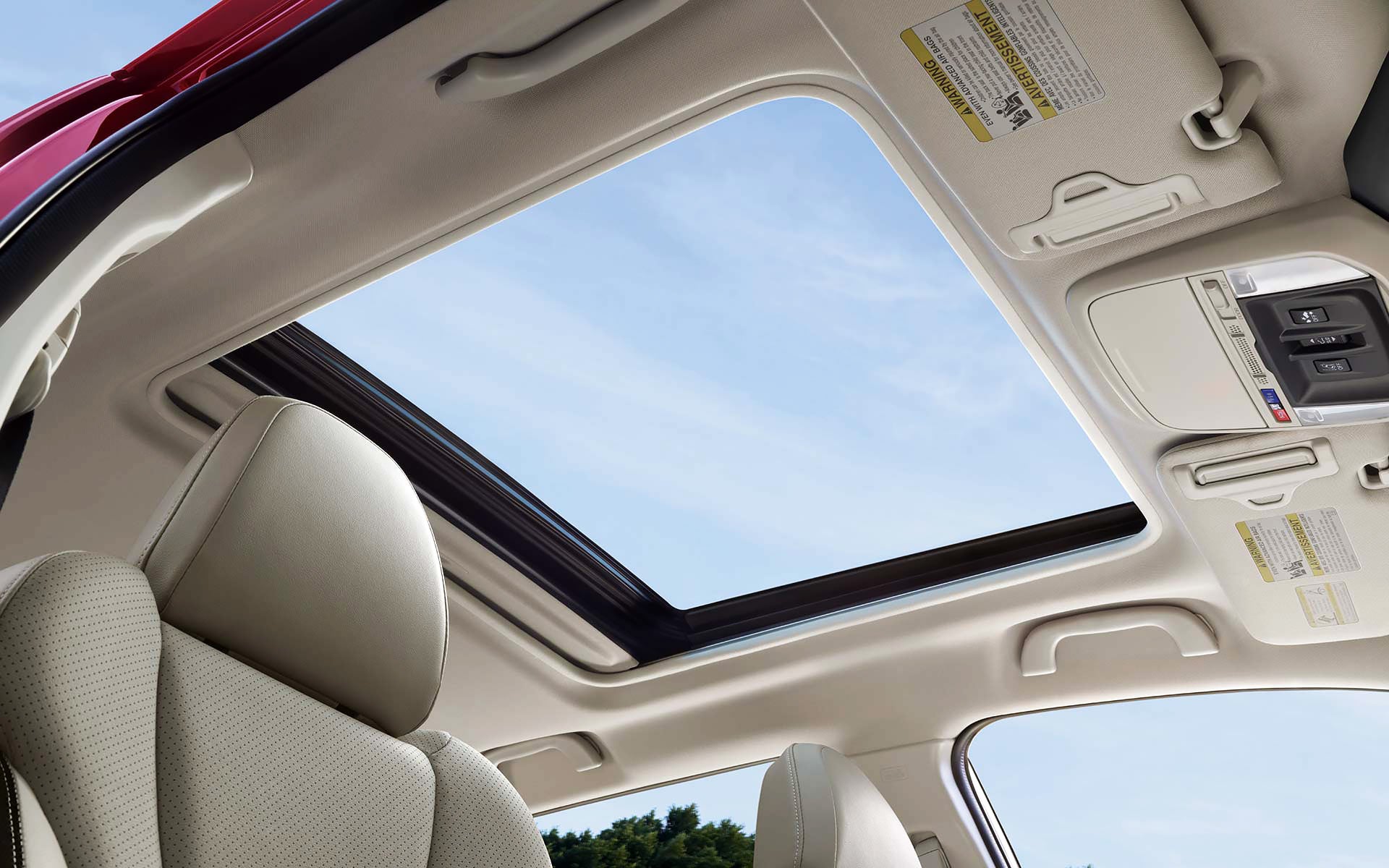A view through the power sliding panoramic moonroof on the 2022 Forester Sport. | LaFontaine Subaru in Commerce Township MI