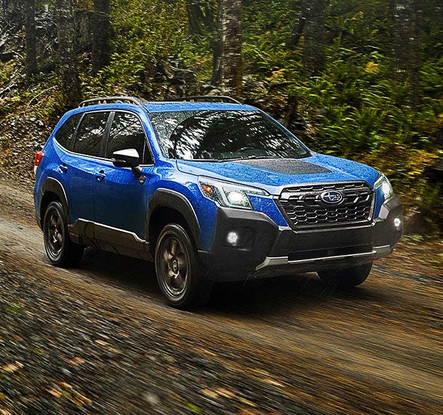 A 2022 Forester driving on a highway. | LaFontaine Subaru in Commerce Township MI