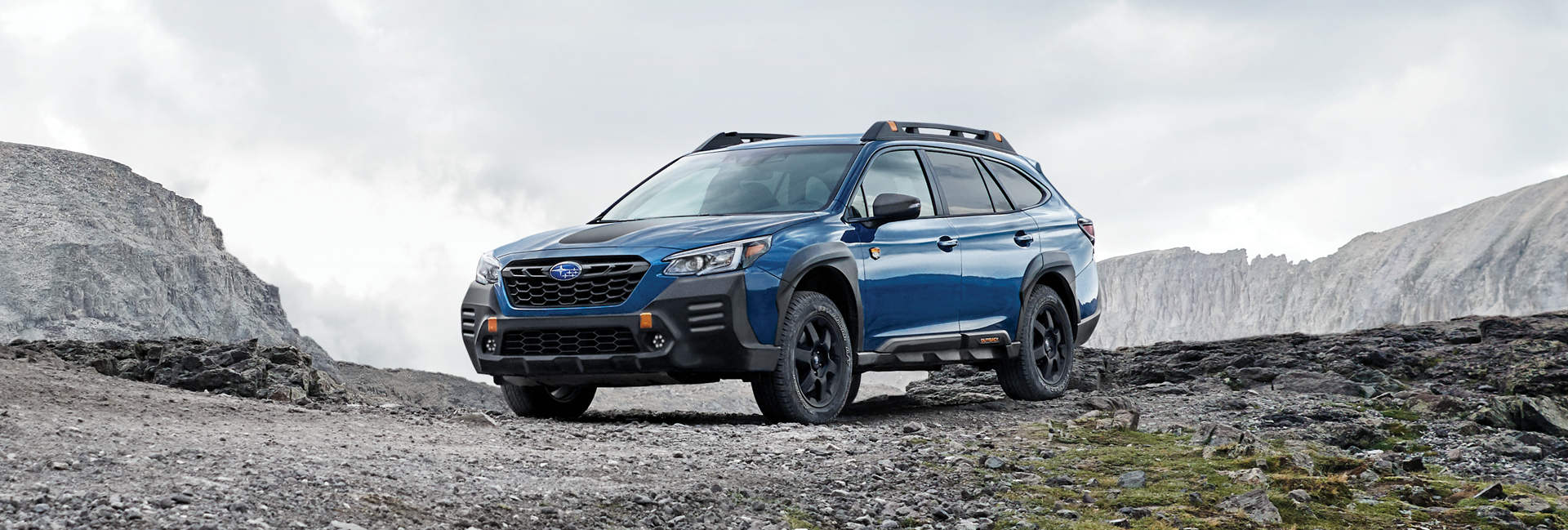 A 2023 Outback Wilderness parked in the mountains. | LaFontaine Subaru in Commerce Township MI
