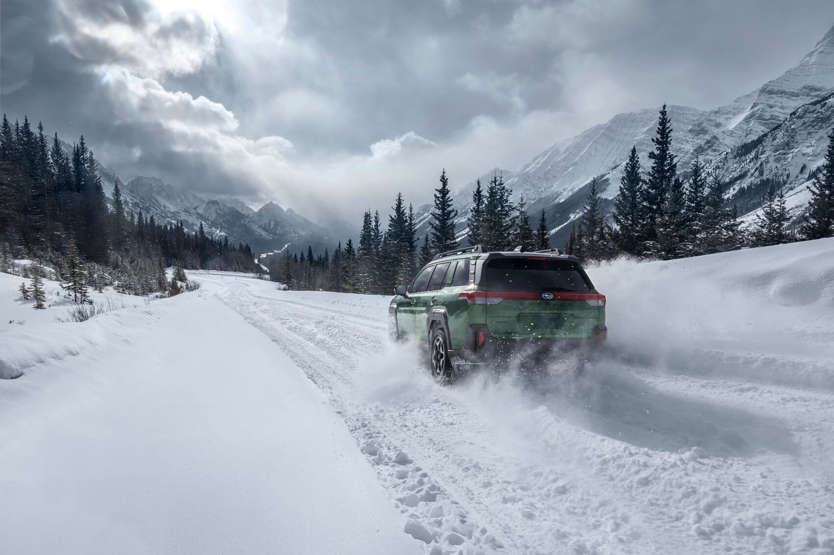 Subaru Outback driving on snow covered road